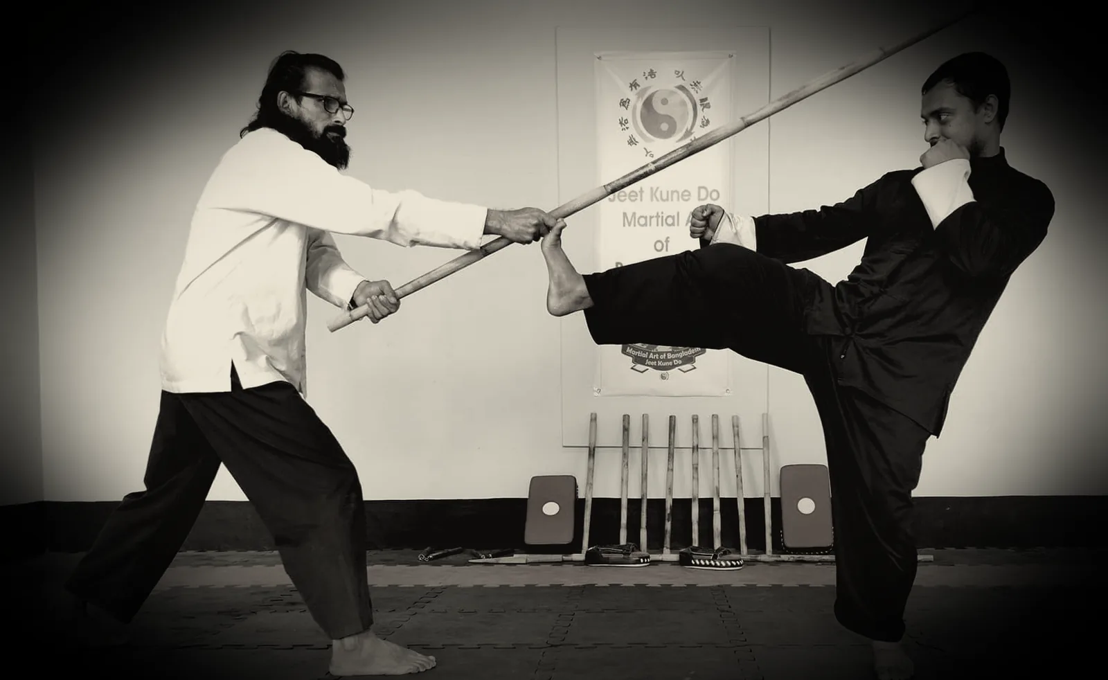JKDBD lead instructor and a student exchanging a kick and hand trap during training in Dhaka