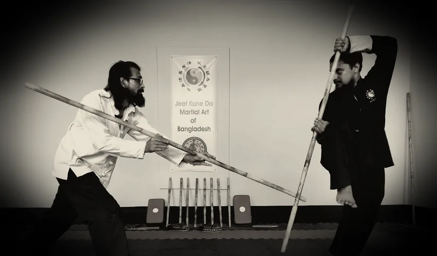 JKDBD instructor and student demonstrating a long-stick technique during training