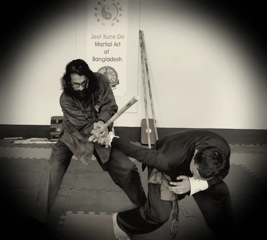 JKDBD instructor and student practising a weapon-based partner drill